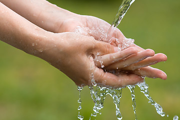 Image showing closeup of woman washing her hands