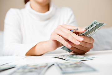 Image showing Hands counting money, close up