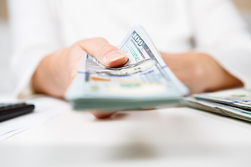 Image showing Hands of person proposing money to you - closeup shot