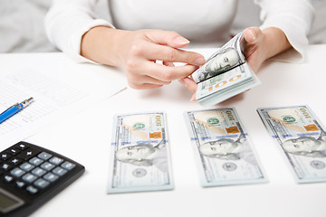 Image showing Hands counting money, close up