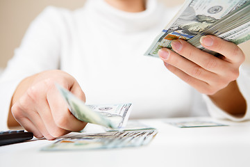 Image showing Hands counting money, close up