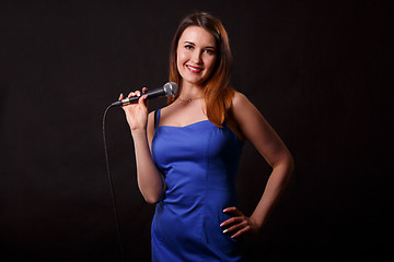 Image showing Smiling woman in blue dress