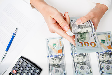 Image showing Hands counting money, close up