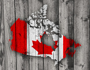 Image showing Map and flag of Canada on weathered wood