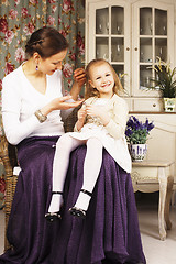 Image showing young mother with daughter at luxury home interior vintage