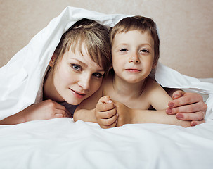 Image showing young blond woman with little boy in bed, mother and son, happy familyyoung blond woman with little boy in bed, mother and son, happy family