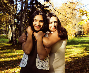 Image showing mature real mother with daughter outside autumn fall in park