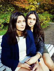 Image showing mature real mother with daughter outside autumn fall in park