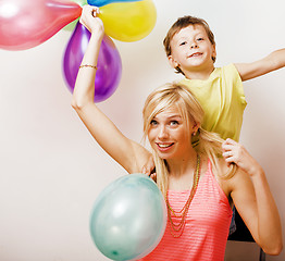 Image showing pretty real family with color balloons on white background, blon