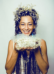 Image showing young pretty brunette girl with bouquet of little white spring f