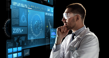 Image showing scientist in goggles looking at virtual screen