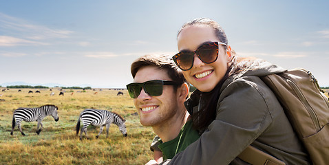 Image showing smiling couple with backpacks traveling in africa