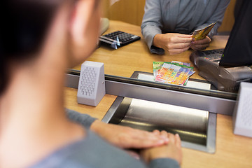 Image showing clerk counting cash money at bank office