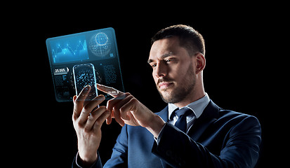 Image showing businessman with smartphone and virtual screen