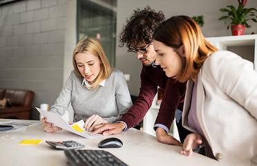 Image showing happy business team with papers in office