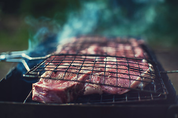 Image showing Grilling fresh entrecote pork