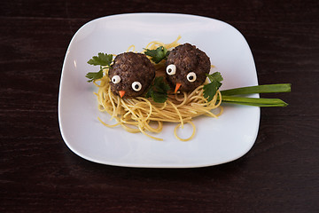 Image showing Funny meatballs with pasta