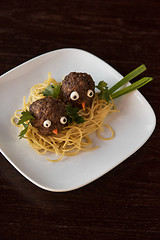 Image showing Funny meatballs with pasta