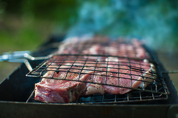 Image showing Grilling fresh entrecote pork