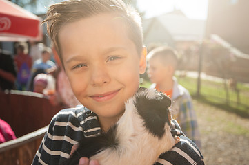 Image showing happy smiling boy with cavy