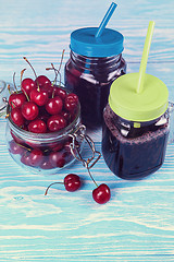 Image showing Cherry juice with glass of berries