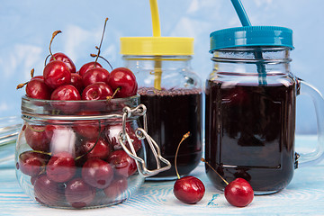 Image showing Cherry juice with glass of berries