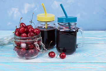 Image showing Cherry juice with glass of berries