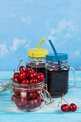 Image showing Cherry juice with glass of berries