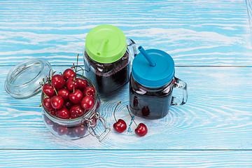 Image showing Cherry juice with glass of berries