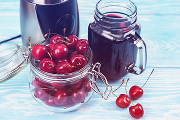 Image showing Cherry juice with glass of berries