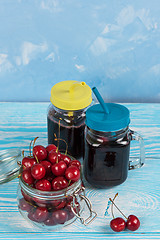 Image showing Cherry juice with glass of berries