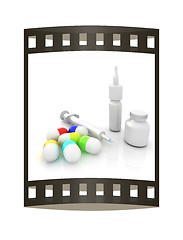 Image showing Syringe, tablet, pill jar. 3D illustration. The film strip