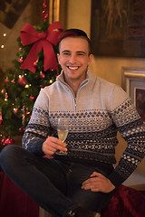 Image showing Happy young man with a glass of champagne