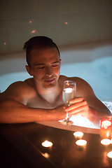 Image showing man relaxing in the jacuzzi