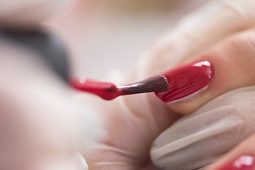 Image showing Woman hands receiving a manicure