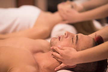 Image showing couple enjoying head massage at the spa