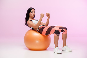 Image showing The woman training against pink studio