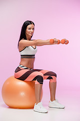 Image showing The woman training against pink studio