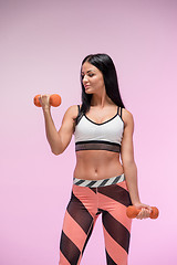 Image showing The woman training against pink studio