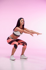 Image showing The woman training against pink studio