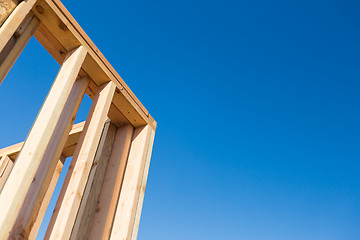 Image showing Wood Home Framing Abstract At Construction Site.