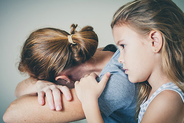 Image showing sad daughter hugging his mother