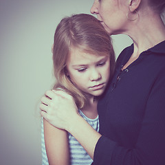 Image showing sad daughter hugging his mother