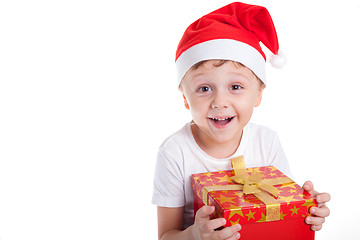 Image showing Happy little smiling boy with christmas gift box.