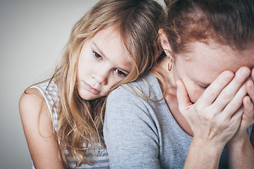 Image showing sad daughter hugging his mother