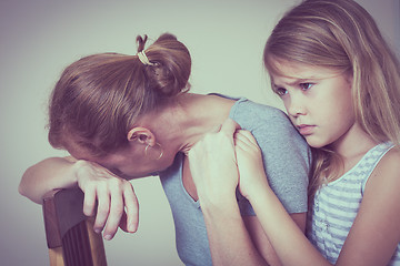 Image showing sad daughter hugging his mother