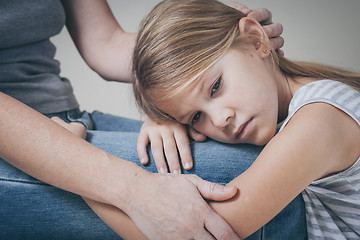 Image showing sad daughter hugging his mother