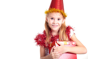 Image showing Happy little smiling girl with christmas gift box.