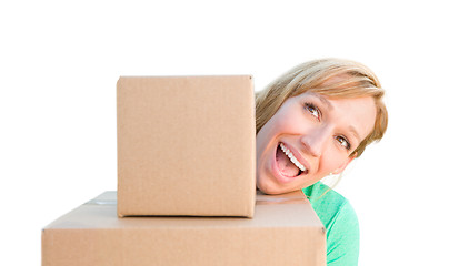 Image showing Happy Young Adult Woman Holding Moving Boxes Isolated On A White