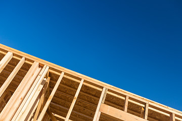 Image showing Wood Home Framing Abstract At Construction Site.